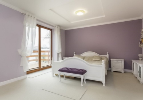 Tuscany - interior of purple bedroom with white furniture